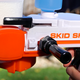 The original Skid Shot used two manual levers to prime each shot.